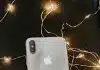 Silver Iphone X Lying on Pre-lit String Lights