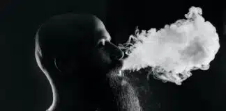 man smoking with black background