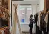 woman standing selecting clothes