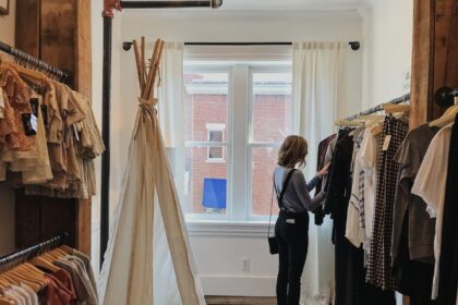 woman standing selecting clothes
